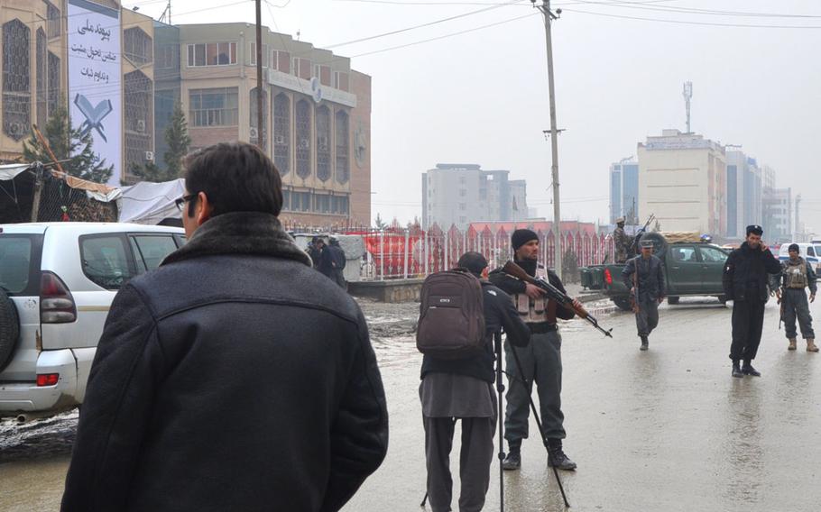 Following a suicide attack on a cultural center and library in Kabul on Thursday, Feb. 20, 2014, Afghan police guarded the road and kept reporters at a distance. Officials said the bomber detonated himself outside the cultural center around 9:30 am.

Cid Standifer/Stars and Stripes