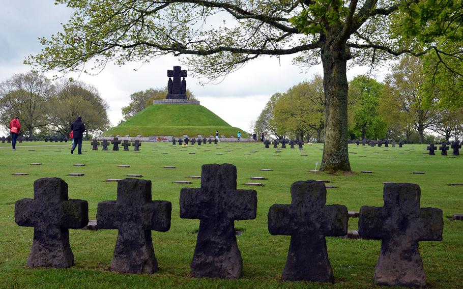 The German War Cemetery at La Cambe, France. It is the final resting place for 21,140 German war dead. In the mound, underneath the large cross, 296 fallen are interred.