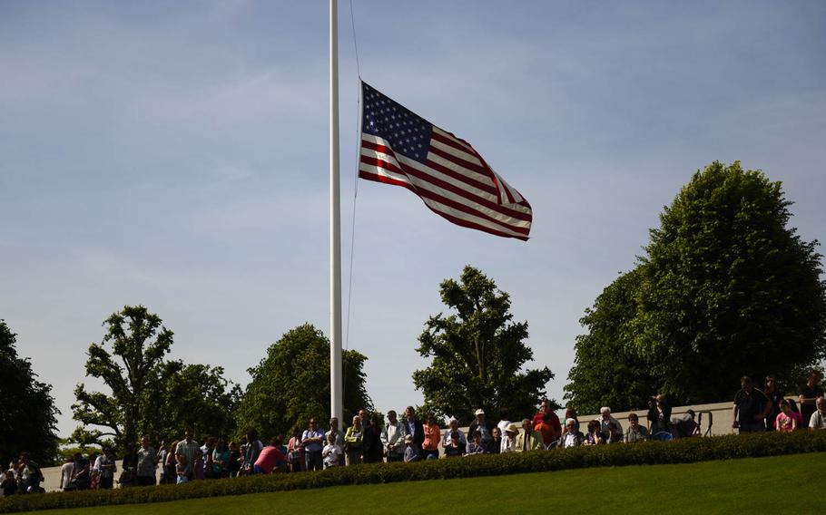 Observers watch the Memorial Day ceremony at Lorraine American Cemetery Sunday, May 25, 2014, at St. Avold, France.