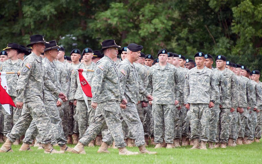 Maj. Gen. Richard Longo, deputy commanding general of U.S. Army Europe and commander of U.S. Army NATO, leads outgoing 2nd Cavalry Regiment commander Col. Douglas Sims and new 2CR commander Col. John Meyer during a troop inspection, on Tuesday, July 15, 2014.