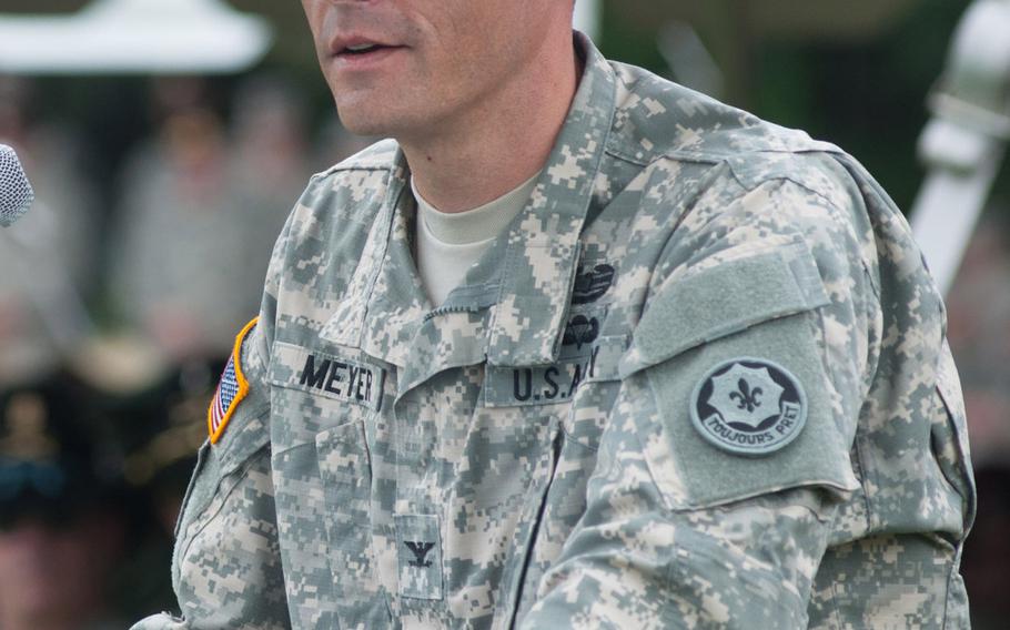 Col. John Meyer, the new commander of the 2nd Cavalry Regiment, addresses the crowd during the mass change of command ceremony held at Vilseck, Germany on Tuesday, July 15, 2014.