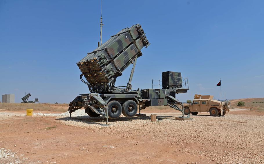 Patriot missile launchers from the 5th Battalion, 7th Air Defense Artillery Regiment stand on a hillside at a Turkish army base overlooking the city of Gaziantep.