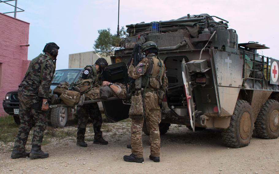 The German portion of Steadfast Javelin II, a NATO Allied Land Command-led multinational training exercise was held at the Joint Multinational Readiness Center at Hohenfels, Germany, Sept. 8, 2014. Part of that exercise involved the diminishing manpower of an embedded force during the course of days-long battle. Here, Slovenian troops load up a ?casualty? during the final minutes of the exercise.

Michael S. Darnell/Stars and Stripes