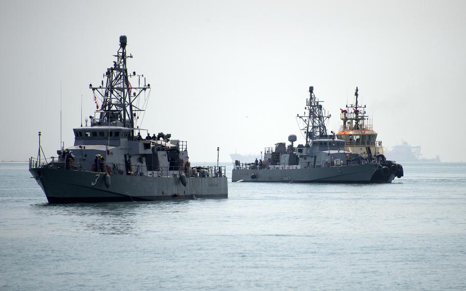 The coastal patrol ships USS Hurricane and USS Monsoon arrive at their new homeport of Naval Support Activity Bahrain, Aug. 13, 2014. The Hurricane and Monsoon are the last two of 10 coastal patrol ships that are part of a realignment plan in the U.S. 5th Fleet area of responsibility.