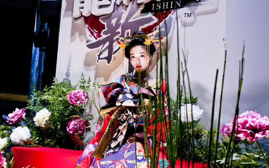 A costume player model helps advertise a new game at Tokyo Game Show 2013. Costume play, or cosplay, is the act of wearing costumes and accessories that resemble clothing from video games or movies and has become very popular in some gaming circles.