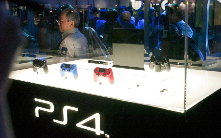 A case at the Sony booth at Tokyo Game Show 2013 shows the design of the PlayStation 4 before its release.