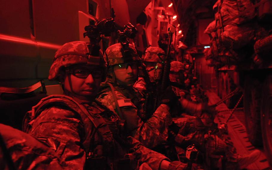 Troops assigned to 3rd Platoon, Apache Troop, 1st Squadron, 2nd Cavalry Regiment get ready to disembark their flight for a night time airfield seizure mission during Exercise Steadfast Javelin II at Leilvarde Airbase, Latvia, Sept. 5, 2014. Steadfast Javelin is a NATO exercise involving over 2,000 troops from 10 nations.