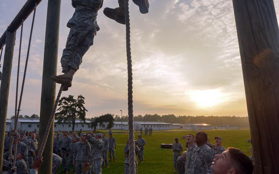 U.S. soldiers and cadre members at the 7th Army Noncommissioned Officer Academy conduct physical readiness training at Grafenwoehr, Germany, Sept. 10, 2014.