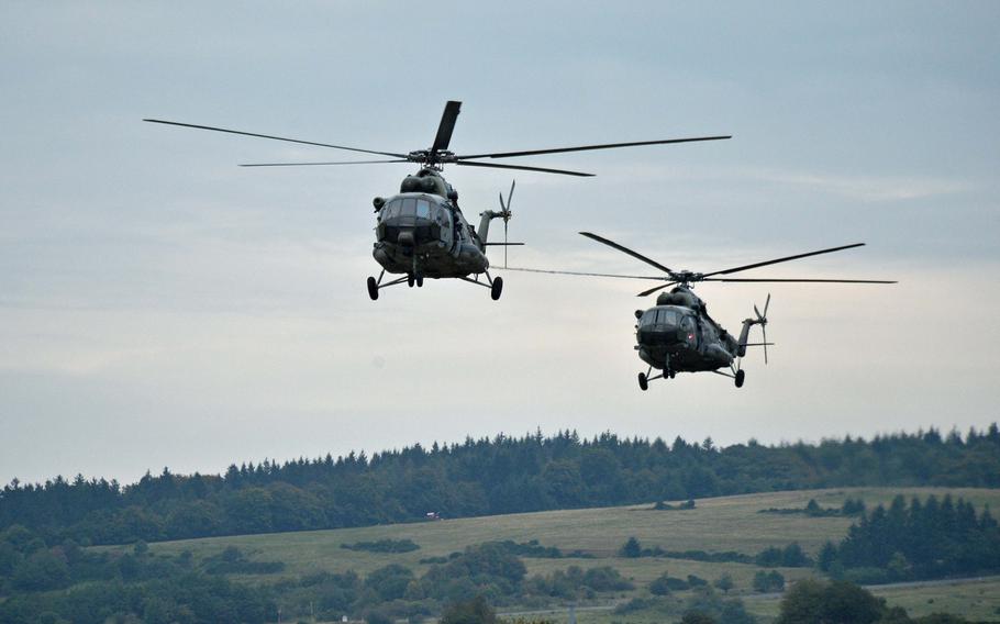 Two Czech MI-171 helicopters come in for a landing to extract special operations troops during a demonstration at Jackal Stone 14, an exercise hosted by the U.S. Special Operations Command Europe at Baumholder, Germany, Friday, Sept. 12, 2014. Forces from 10 nations are taking part in the event in numerous locations in Germany and the Netherlands.