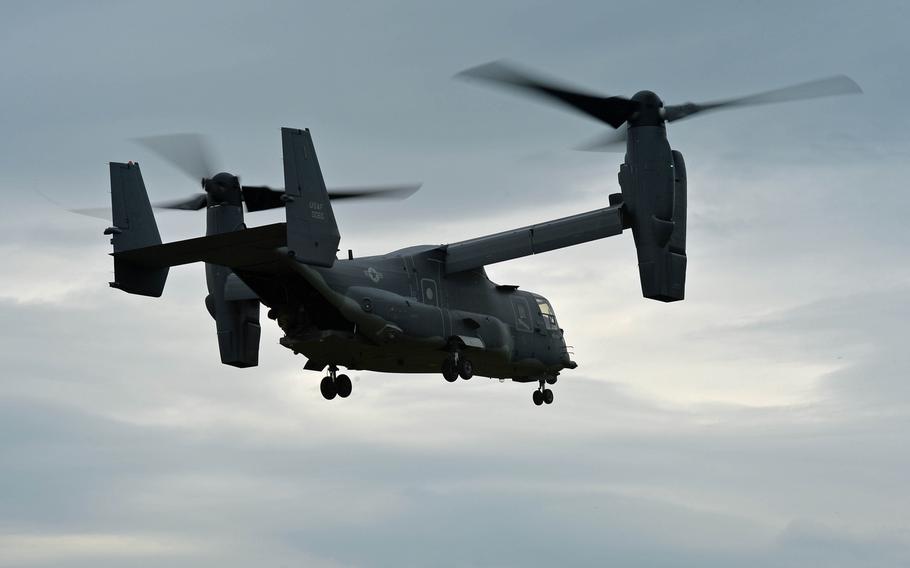 A U.S. Air Force CV-22 Osprey  flies away after extracting special operations forces during a demonstration at Jackal Stone 14, an exercise hosted by the U.S. Special Operations Command Europe at Baumholder, Germany, Friday, Sept. 12, 2014. Forces from 10 nations are taking part in the event in numerous locations in Germany and the Netherlands.