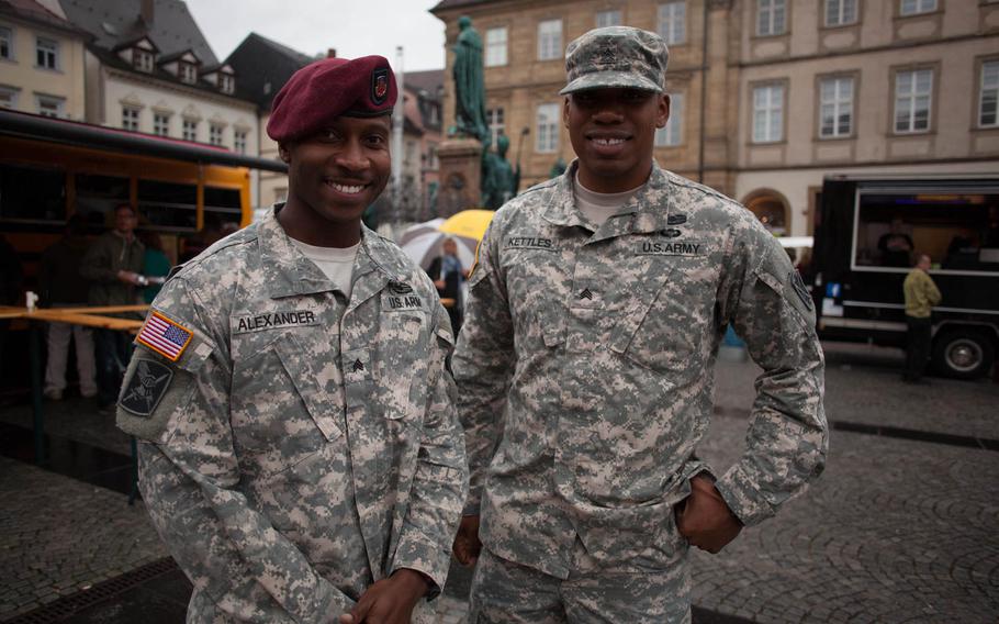 Sgt. Cornelius Kettles and Sgt. Shawn Alexander, both former members of the Army's 173rd Airborne Brigade in Bamberg, Germany, attend a farewell festival put on by the city Friday, Sept. 12, 2014, to say goodbye to the U.S. Army, which had been in the city since 1945. The garrison cased its colors and lowered the American flag at Warner Barracks for the last time Friday.