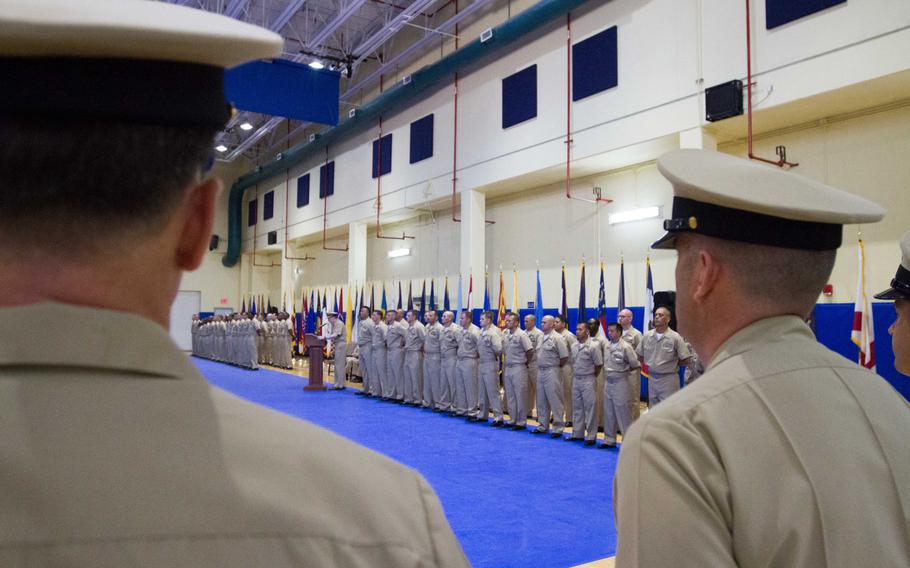 Vice Adm. John Miller, commander of U.S. 5th Feet, speaks at a chief pinning ceremony at Naval Support Activity Bahrain on Tuesday, Sept 16, 2014. On both sides of him, 55 chief selects stand in ranks waiting to be pinned to the rank of chief petty officer.