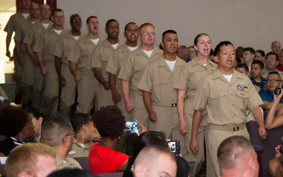 Chief petty officer selectees march while singing cadence during a chief pinning ceremony at Naval Air Facility Atsugi on Tuesday, Sept. 16, 2014. Twelve chief petty officers from NAF Atsugi and its tenant commands received their anchors and combination covers during the ceremony.