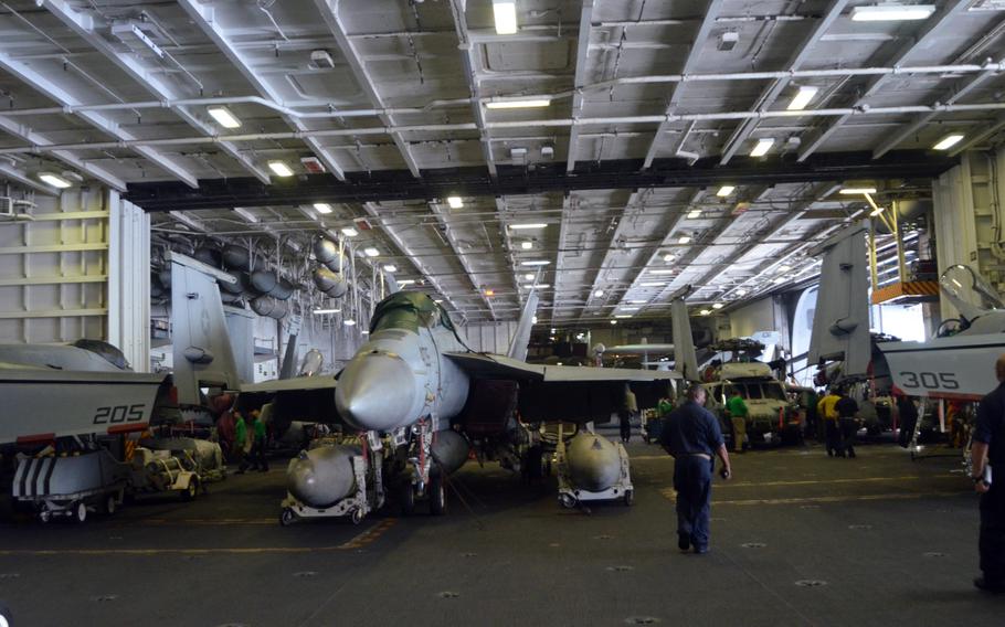 The USS George Washington's hangar decked is crowded with fighter jets and other aircraft during Valiant Shield on Wednesday. The exercise includes 18,000 servicemembers from the Navy, Air Force, Marines and Army.