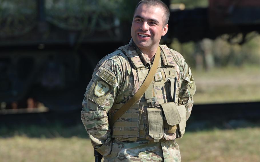 Lt. Beka Metreveli, a Georgian platoon leader, watches as fellow soldiers go through training at Exercise Rapid Trident near Yavoriv, Ukraine, Thursday, Sept. 18, 2014.