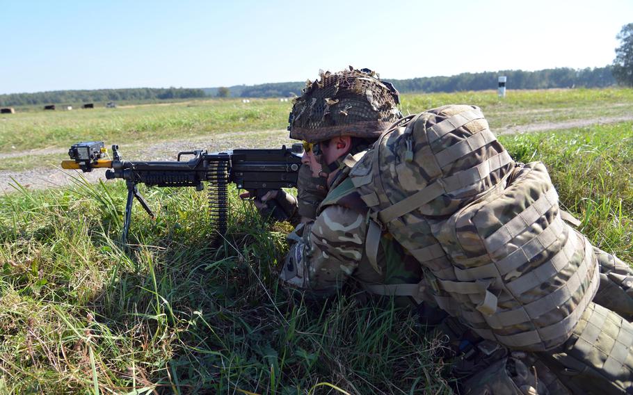 A British soldiers guards the perimeter during training at Exercise Rapid Trident near Yavoriv, Ukraine, Thursday, Sept. 18, 2014.