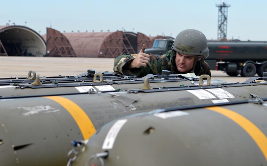 Air Force Staff Sgt. Tyler Hardman ensures munitions are loaded properly on a trailer during the Beverly Bulldog 14-04 exercise at Osan Air Base, South Korea, on Sept. 18, 2014.
