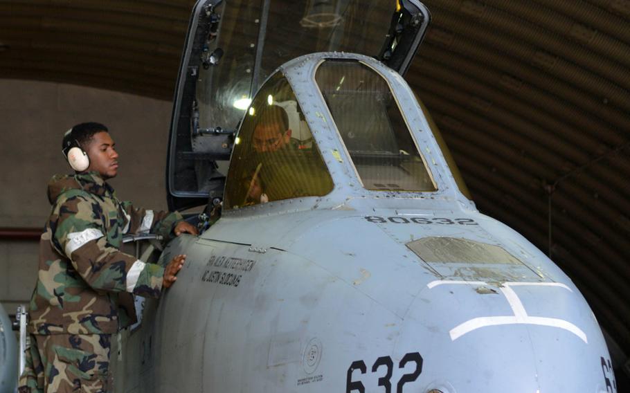 Air Force airmen maintenance crew performs a check inside an A-10 Thunderbolt II cockpit during the Beverly Bulldog 14-04 exercise at Osan Air Base, South Korea, on Sept. 18, 2014.