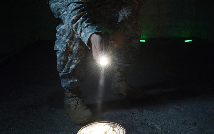 U.S. Army Sgt. 1st Class Dennis Roe, with the 52nd Signal Battalion, prepares a gas chamber for their annual Chemical Biological Radiological and Nuclear training at the Boeblingen Local Training Area, Germany, on Sept. 9, 2014.