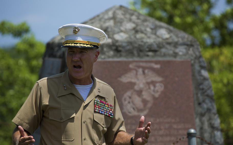 Maj. Gen. Charles L. Hudson, commander of Marine Corps Installations, Pacific gives remarks in front of the 1st Marine Division Memorial, during a tour of memorial sites around the island in honor of the 70th anniversary of the landing on Peleliu, Palau, Sept. 15, 2014.