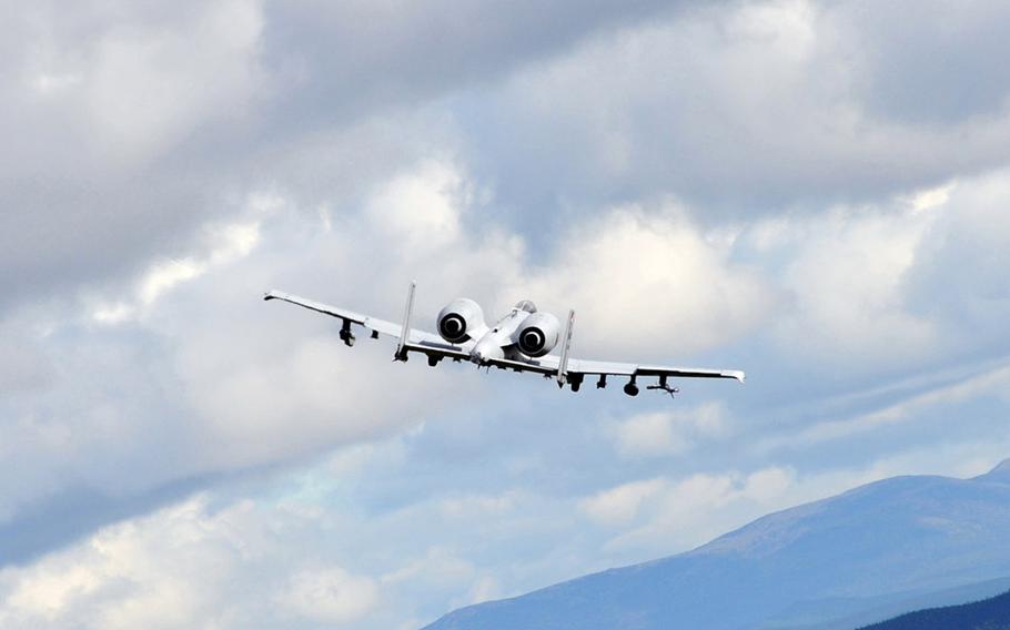 Two A-10 Thunderbolts bank after a strafing run on Aug. 20, 2014, during the Red Flag-Alaska 14-3 exercise at the Yukon Training Area, Alaska.