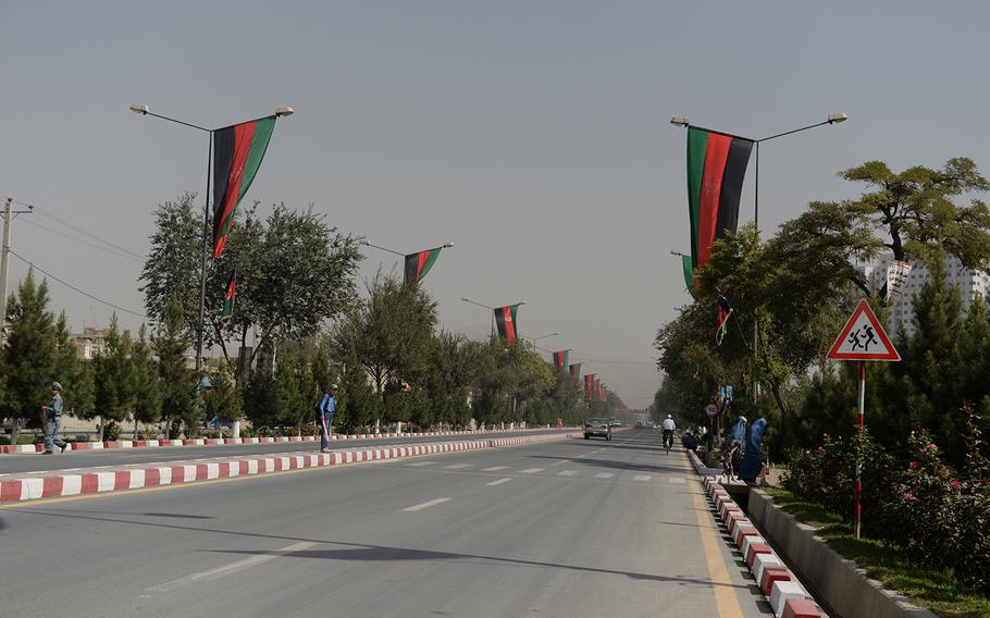 Afghan flags line Airport Road in Kabul on Sunday, Sept. 28, 2014 ahead of Monday's presidential inauguration ceremony. Ashraf Ghani will be sworn in as the new head of state after a bruising five-month electoral battle.