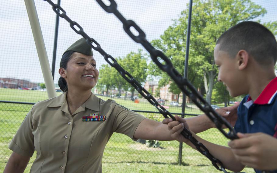 Marine Sgt. Jennifer Suarez pushes her son, Anthony, on a swing at Barnett Park in Quantico, Va., May 8, 2015. After a long road, Suarez beat brain cancer to return to active duty in the Marine Corps.