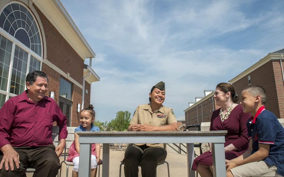 Marine Sgt. Jennifer Suarez, center, is surrounded by family during a recent visit to The Basic School at Quantico, Va., May 8, 2015. Suarez says she leaned heavily on her family to help her beat brain cancer and return to active duty.