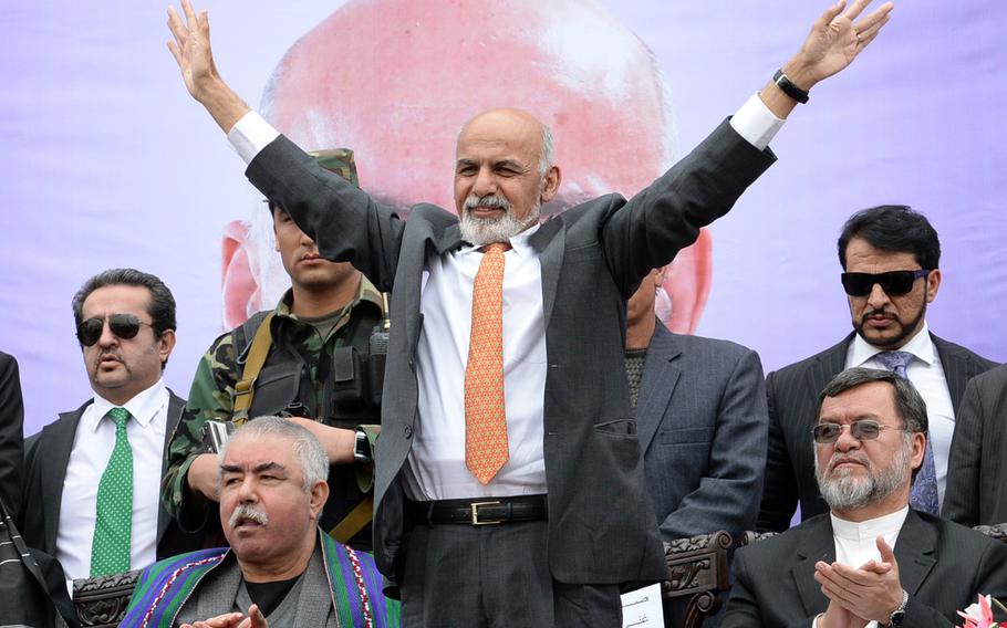 Then-presidential candidate Ashraf Ghani waves to the crowd at a campaign rally in Kabul on April 1, 2014. After a 2nd round of voting and a protracted dispute over allegations of fraud, Ghani assumed Afghanistan's presidency in September 2014.