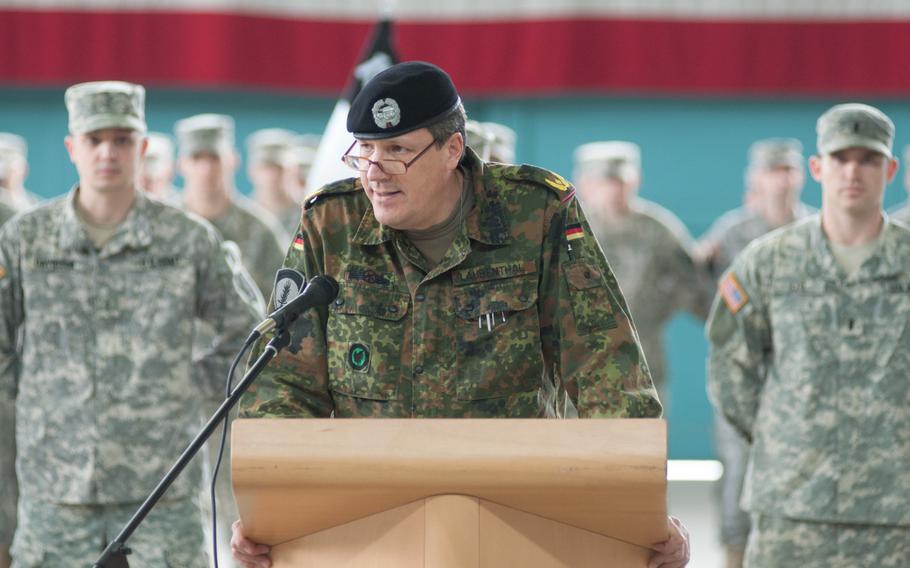 German Brig. Gen. Markus Laubenthal, the U.S. Army Europe chief of staff, speaks to a gathered crowd of 2nd Battalion, 159th Aviation Regiment (Attack Reconnaissance) soldiers during an award ceremony at Storck Barracks in Illesheim, Germany, on Feb. 24, 2015. Laubenthal was on hand to honor six officers from the battalion who assisted in flood relief efforts in southeastern Germany in 2013.