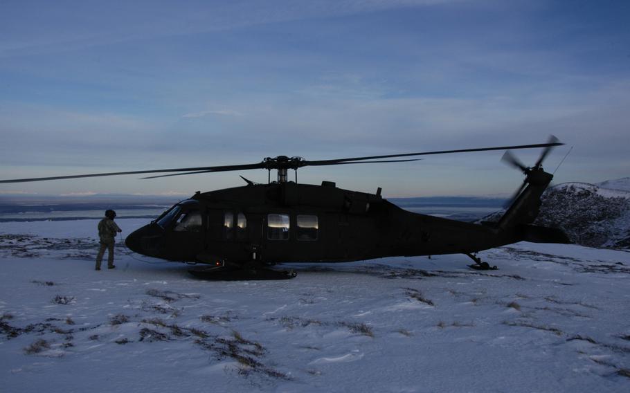 An Alaska Army National Guard UH-60 Black Hawk helicopter prepares to take off from a mountain peak near Anchorage, Alaska, on Feb. 13, 2015. In a matter of minutes, aircraft here can fly beyond the reach of ground-based emergency assistance. 