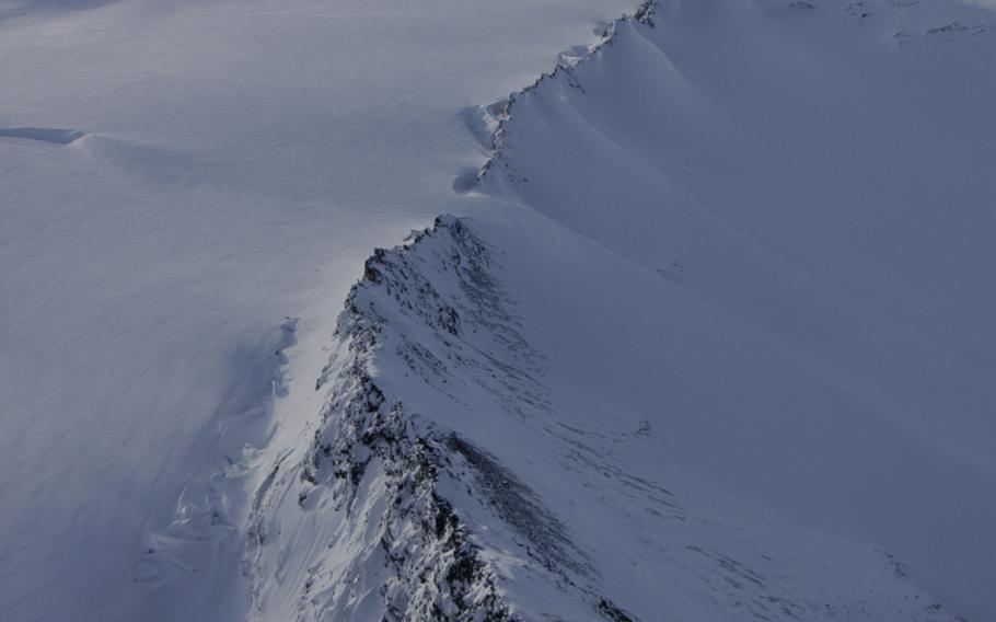 A mountain ridge near Anchorage as seen from an Alaskan Army National Guard Black Hawk helicopter in February 2015. Troops train in cold winter survival tactics because being lost in the Alaskan wilderness could be deadly.