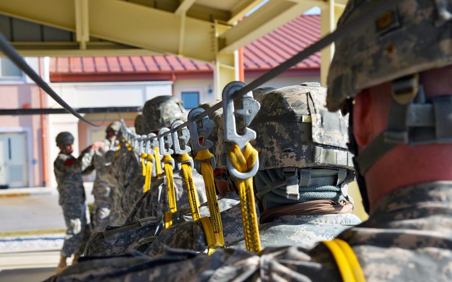 Paratroopers assigned to the 173rd Brigade Support Battalion, 173rd Airborne Brigade, prepare at Aviano Air Base, Italy, for an airborne operation on Juliet Drop Zone in Pordenone, Italy, on Feb. 19, 2015.