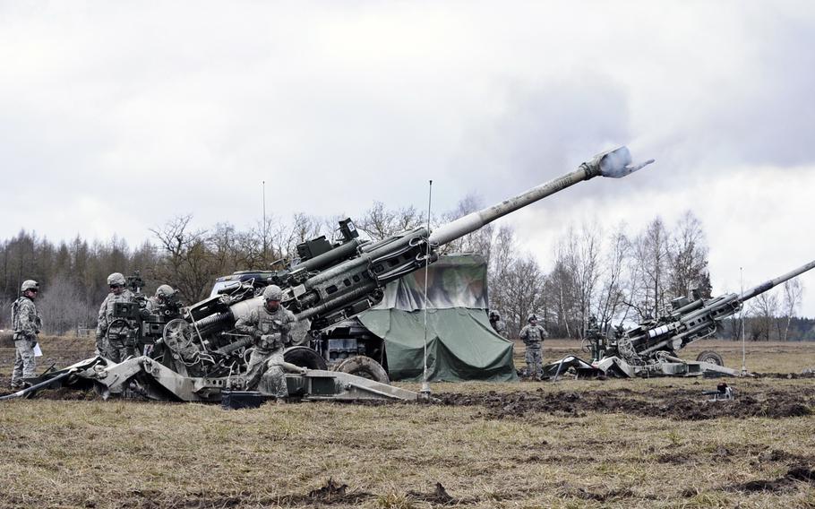 Battery A, Field Artillery Squadron, 2nd Cavalry Regiment soldiers ready their M777 Howitzers during a live-fire exercise at the Grafenwoehr Training Area on Feb. 24, 2015.