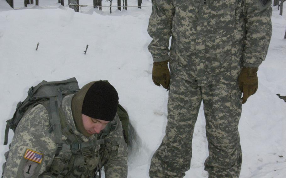 A soldier demonstrates cold-weather survival skills to Gen. Ray Odierno, when the Army chief of staff visited Black Rapids Training Site, Alaska, in February.