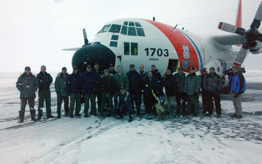 The 22 passengers and crew of Coast Guard HC-130 Hercules airplane 1703 stand for a group photo after successfully reaching the North Pole in 2008. As countries race to gain mineral rights to the Arctic Circle, the U.S. lags behind potential competitor Russia, which is better equipped to traverse the icy region. For instance, the U.S. Navy hasn't has tried to reach the North Pole in the last four years.
