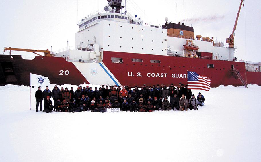 The Coast Guard Cutter Healy's crew poses in front of the cutter after reaching the North Pole on Sept. 6, 2002.  The Healy -- the U.S. millitary's only icebreaker -- became only the second U.S. surface ship to reach the North Pole.