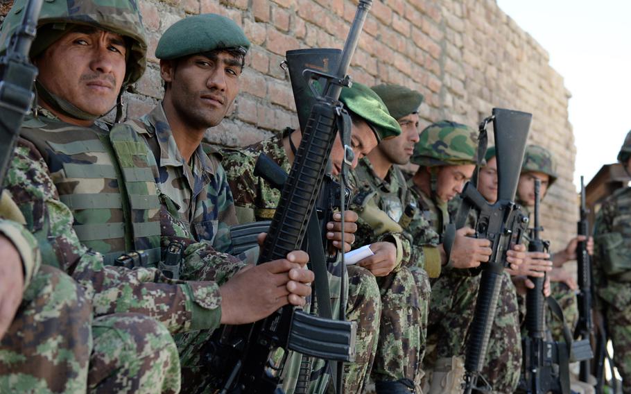 Afghan National Army soldiers stage at a base in Wardak province, Afghanistan, as part of efforts to secure the second round of voting in the national presidential election in 2014. According to newly declassified data provided to the Special Inspector General for Afghanistan Reconstruction, thousands of personnel have been dropped from ANA rolls due to a variety of reasons including deaths.