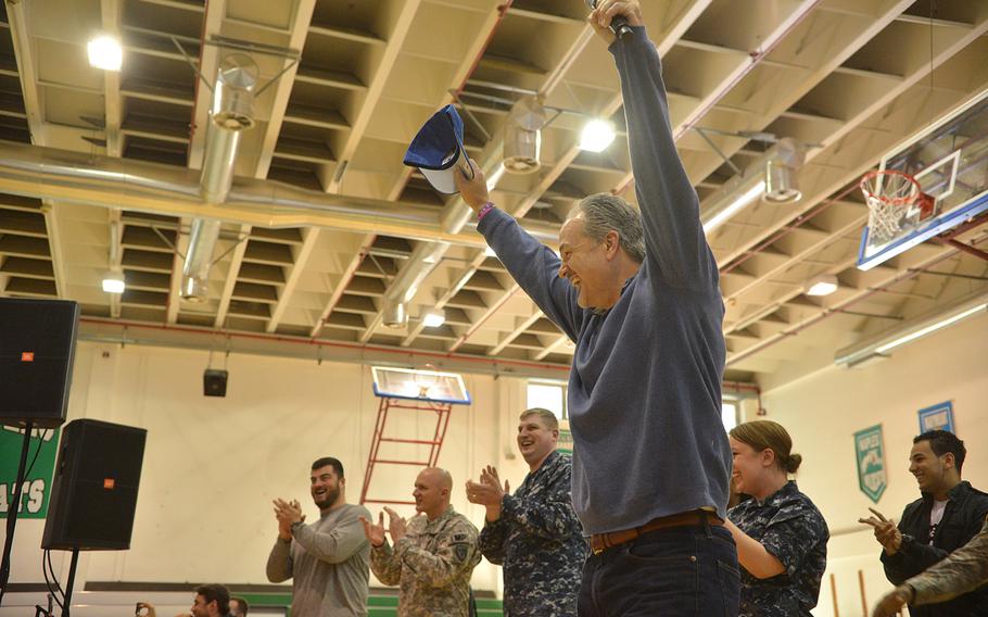 Indianapolis Colts coach Chuck Pagano cheers during a football-throwing event at the USO Spring Troop visit in Naples, Italy, on Monday, March 3, 2015. Pagano is one 10 celebrities joining Vice Chairman of the Joint Chiefs of Staff Adm. James "Sandy" Winnefeld on the tour, which was to visit overseas military bases over seven days.