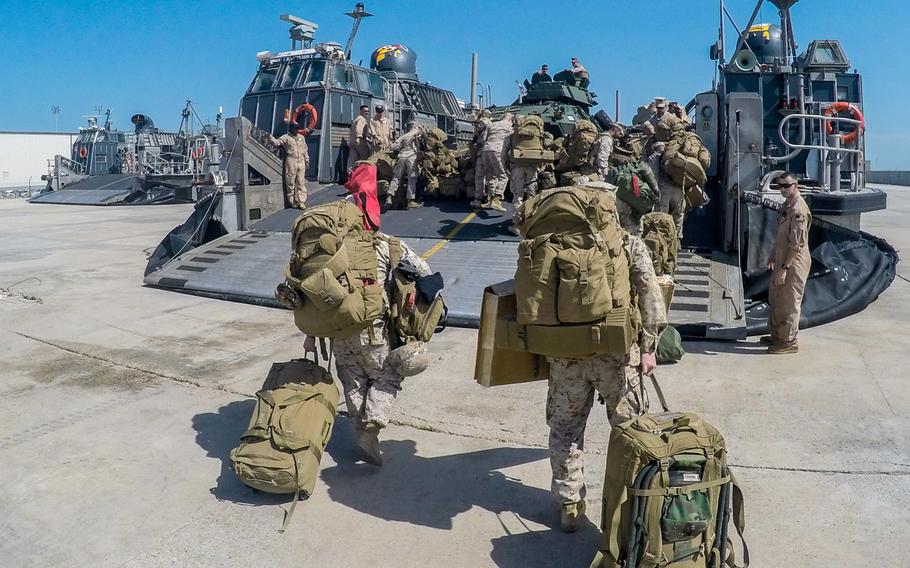 Marines with the 24th Marine Expeditionary Unit board a landing craft air-cushioned transport to return to the USS New York on Sunday, March 1, 2015, after spending a month training in Kuwait. The ship and its embarked Marines are on an eight-month deployment to the U.S. 5th Fleet area of responsibility as part of the Iwo Jima amphibious ready group.