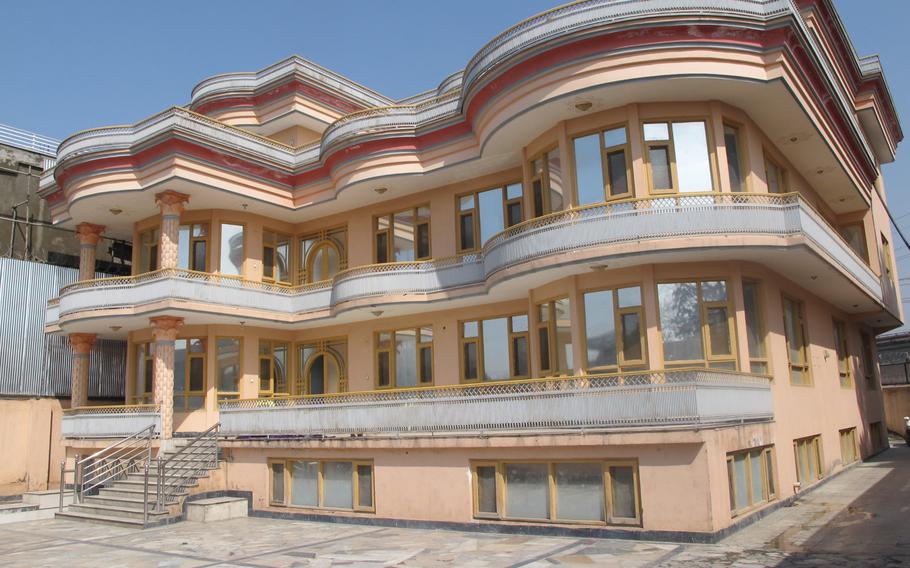 A villa in an upscale neighborhood of Afghanistan's capital. Many of the massive, candy-colored buildings have been empty after some foreign renters moved out following a spate of Taliban attacks in 2014.
