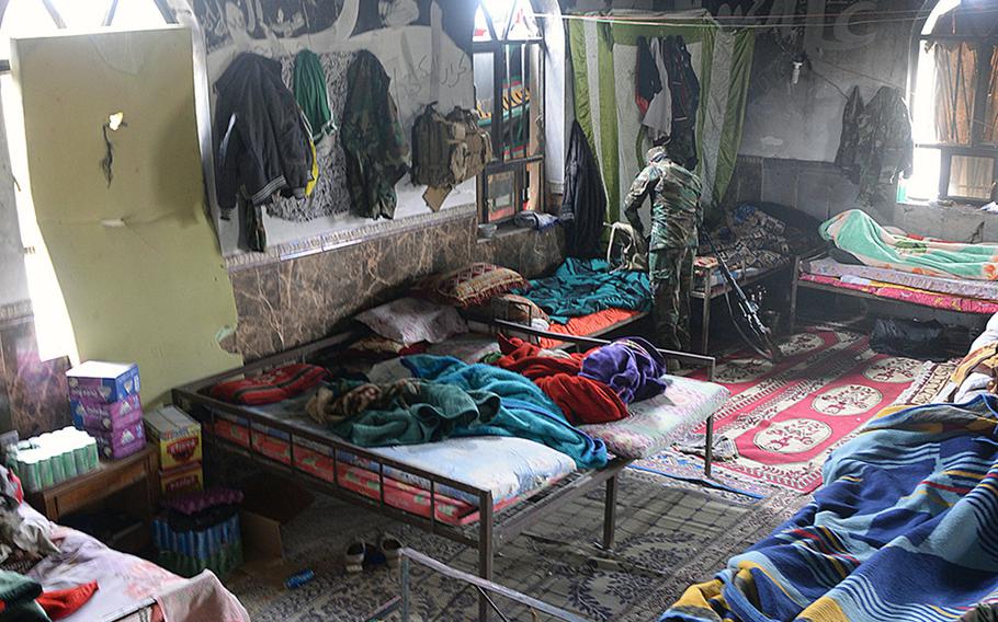 A Badr Organization Shiite militiaman tidies up in the a Jurf al-Nasr mosque, which has been turned into a kitchen and barracks, March 8, 2015. Sunni residents who have yet to be allowed back home used to worship here before the Islamic State group took over.