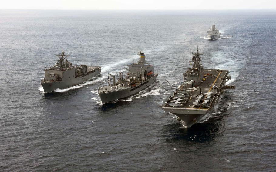 The amphibious dock landing ship USS Ashland, the amphibious transport dock ship USS Green Bay and the amphibious assault ship USS Bonhomme Richard participate in a replenishment-at-sea with the Military Sealift Command fleet replenishment oiler USNS Pecos in the East China Sea, March 11, 2015.