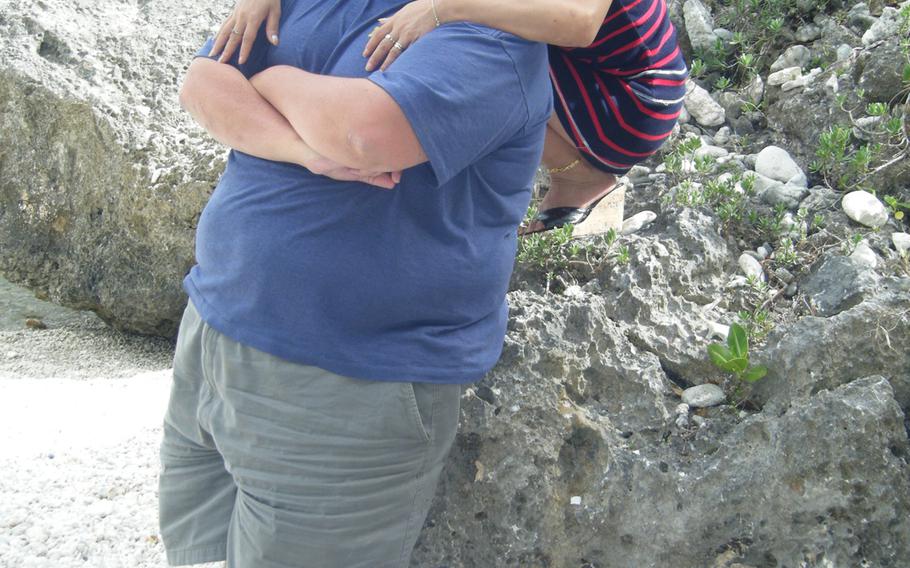 David and Li-Rong Radich at a beach on Saipan. David Radich has filed suit in U.S. federal court to allow him to possess a handgun in his home for self-defense.