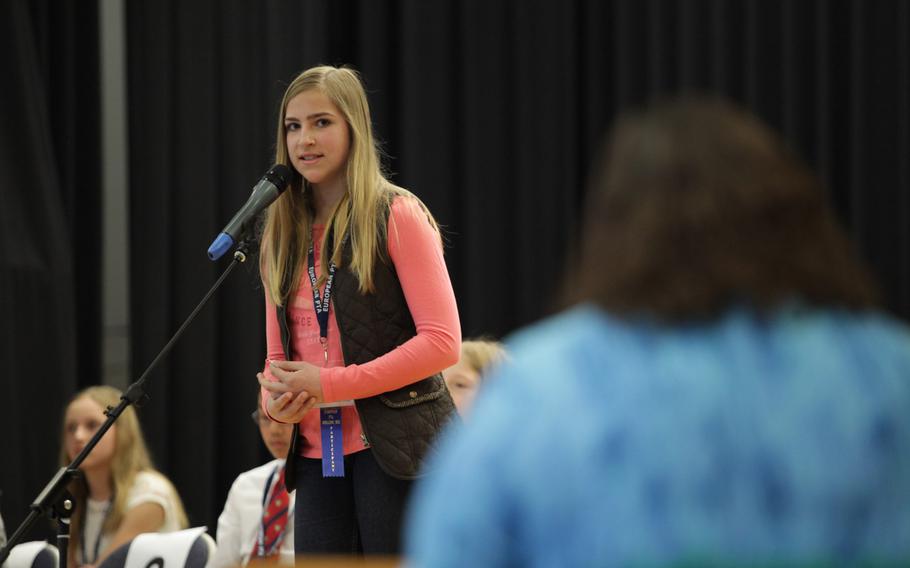Katie Orchard, a 7th grader at Garmisch Elementary-Middle School, asks for the pronouncer to say a word again Saturday, March 21, 2015, at the European PTA Spelling Bee at Ramstein Elementary School in Germany. Orchard tied for 3rd place with Patch Elementary's Larissa Detwiler.