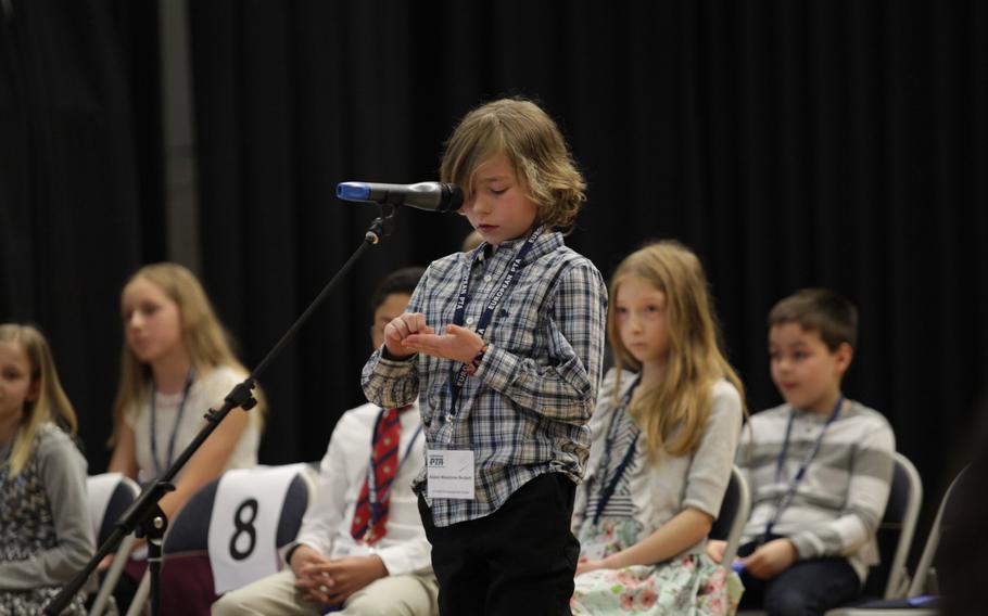 AFNORTH International School's Aidan Woodrow-Beckett spells a word out on his hand Saturday, March 21, 2015, at the European PTA Spelling Bee at Ramstein Elementary School in Germany.