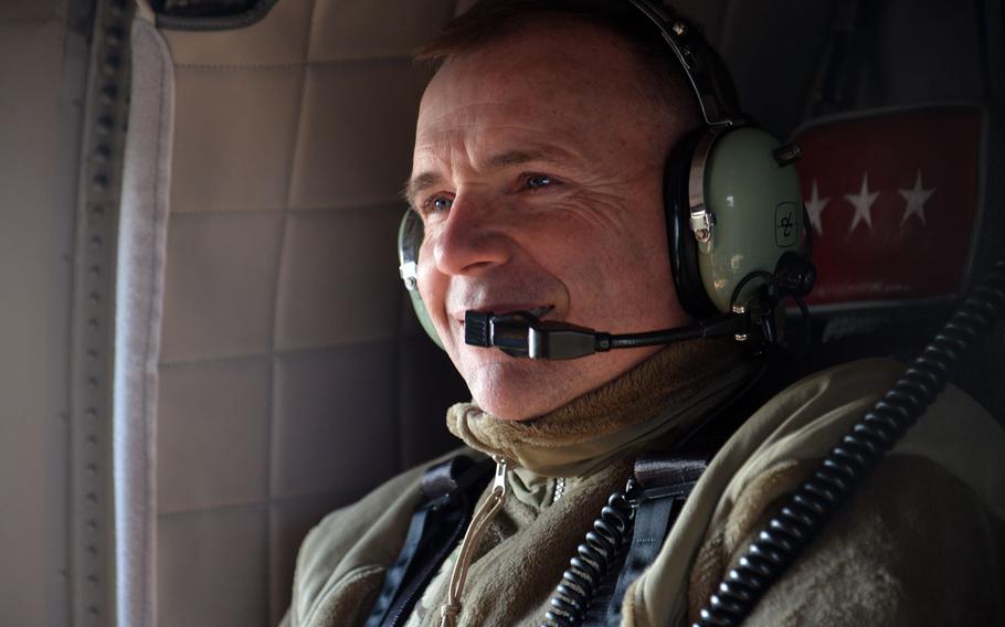 Lt. Gen. Ben Hodges flies in an U.S. Army UH-60 Black Hawk helicopter over Romania, after watching soldiers of the 173rd Airborne Brigade jump into the Smarden Training Area, on Tuesday, March 24, 2015.