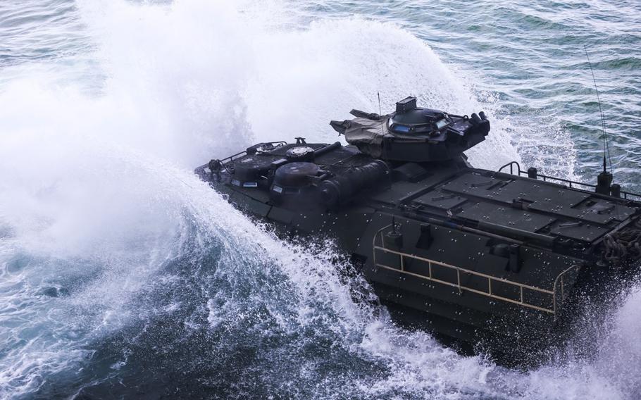 An amphibious assault vehicle splashes from the well deck of the USS Kearsarge into the Atlantic Ocean, on April 13, 2015. Marines used the amphibious assault vehicles as transportation to the shore of Onslow Beach, Camp Lejeune, N.C.