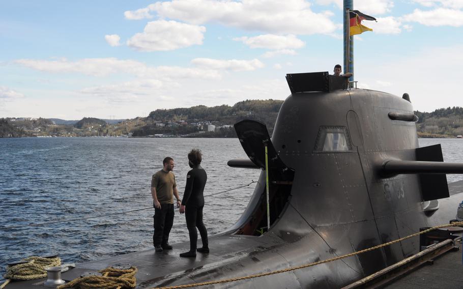 Sailors stand on the German attack submarine U-33 before its participation in Dynamic Mongoose, NATO's anti-submarine warfare exercise held annually off the coast of Norway. 

Steven Beardsley/Stars and Stripes