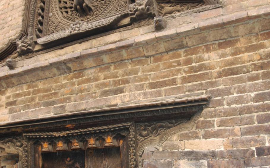Woodwork from the 14th century decorates a building in Bhaktapur, Nepal, Tuesday, May 5, 2015.